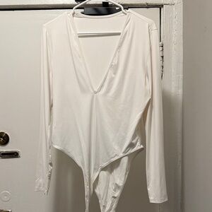 Elegant White V-Neck Bodysuit